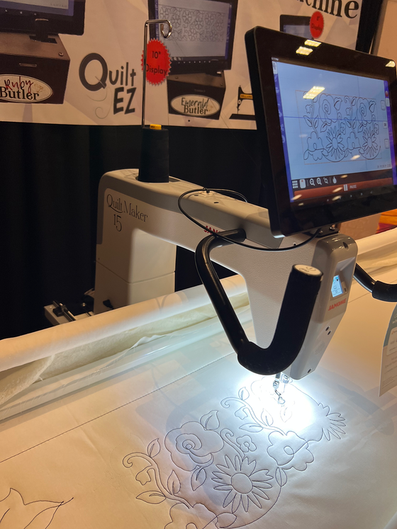 Longarm quilting machine equipped with Butler Quilting Robot automation