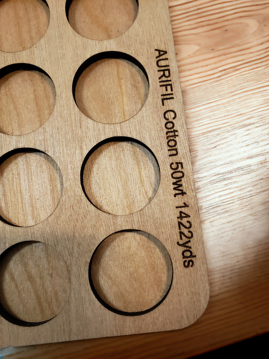 Aurifil Unnumbered Thread Storage Tray, 64 Spools — close-up of the Aurifil spool-size engraving