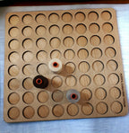 Aurifil Unnumbered Thread Storage Tray, 64 Spools — overhead view with four sample spools