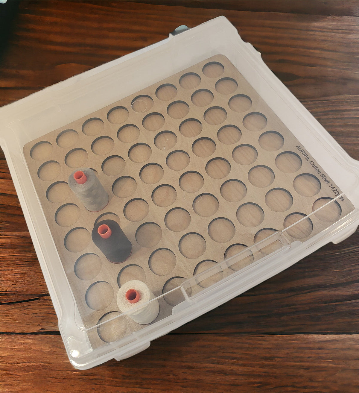 Aurifil Unnumbered Thread Storage Tray, 64 Spools — tray and sample spools beneath a closed clear lid