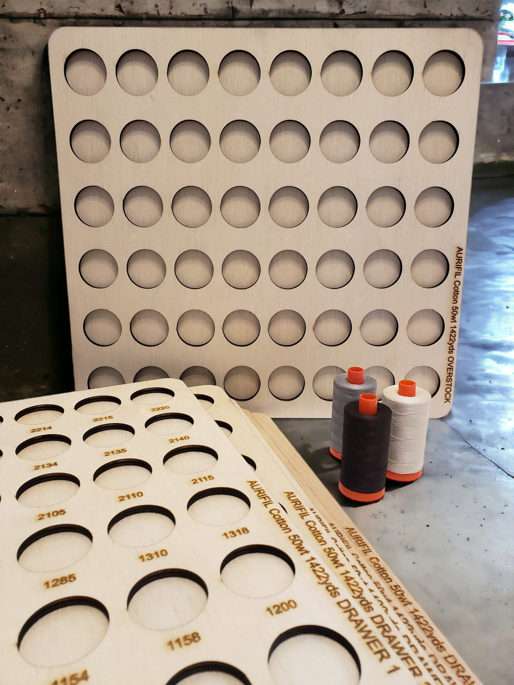 Aurifil Numbered Thread Storage Trays, Set of 6 — numbered trays standing behind a tray and sample spools