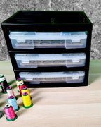 Black three-drawer unit with one drawer extended, furniture shown for context, for Embroidery Thread Storage Trays, Set of 3