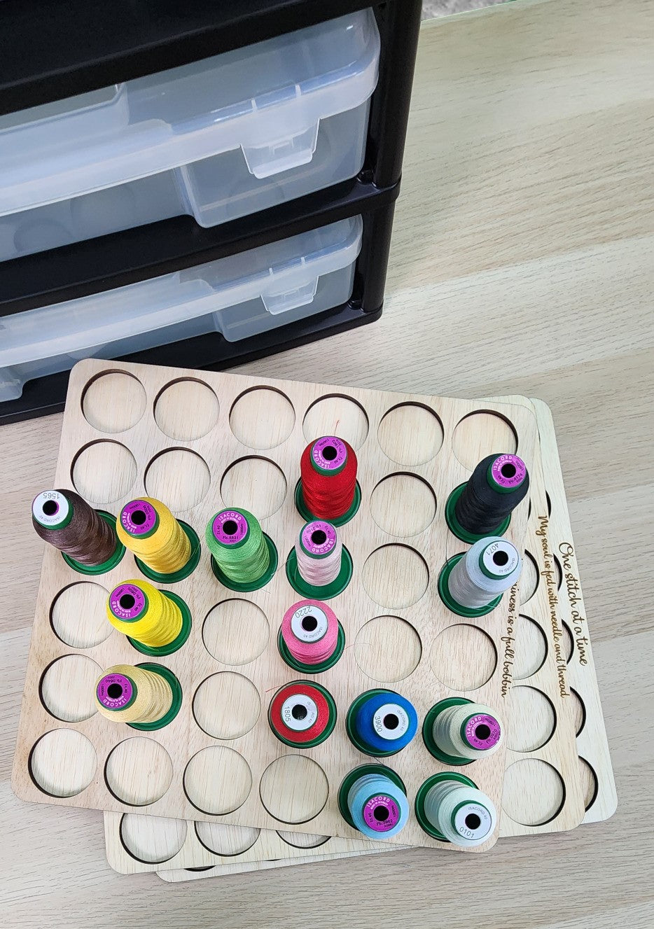 Embroidery Thread Storage Trays, Set of 3 — tray filled with sample spools in front of a drawer unit
