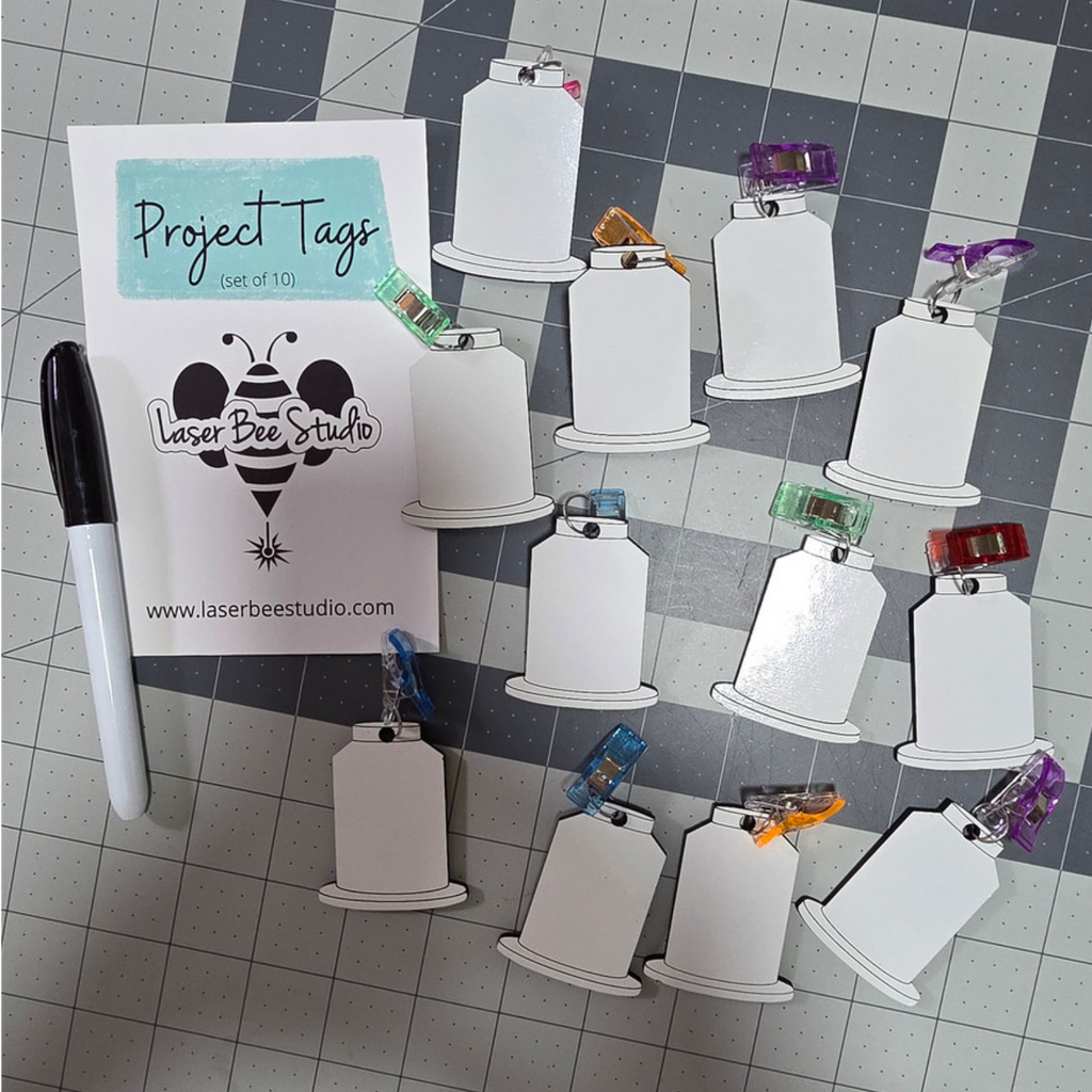 Reusable dry-erase project tags with clips for identifying embroidery project materials