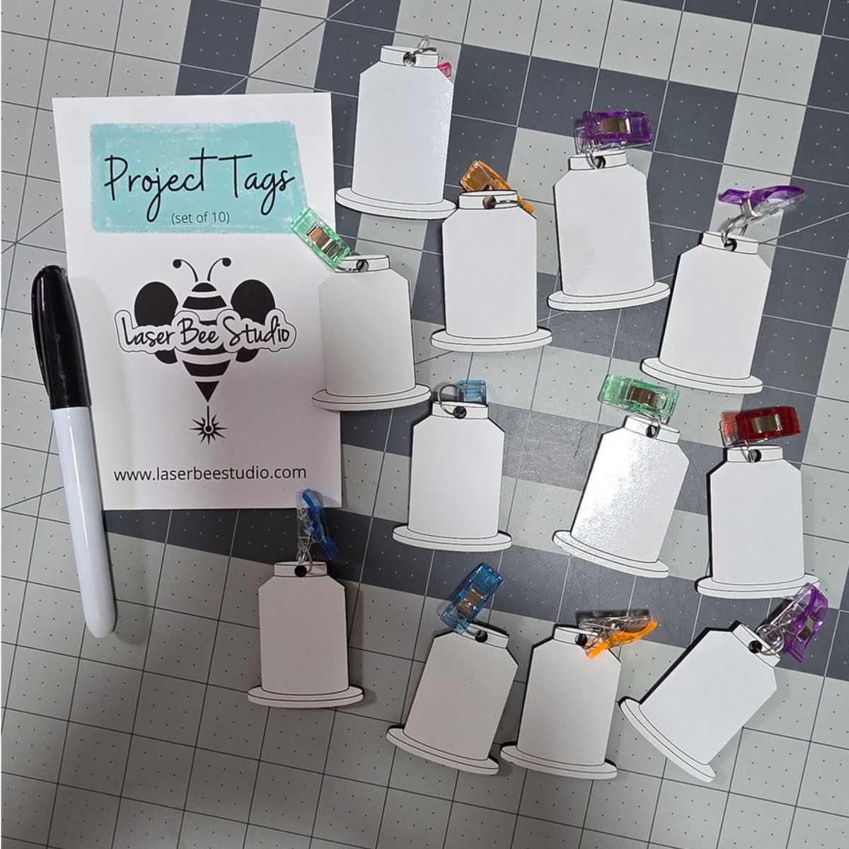 Reusable dry-erase project tags with clips for identifying embroidery project materials
