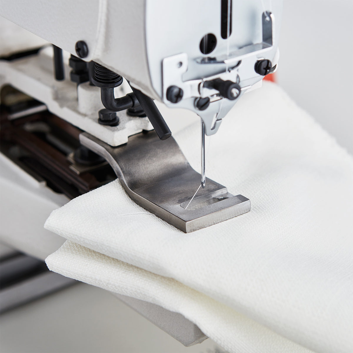 Reliable 8100DT drapery tacker in use