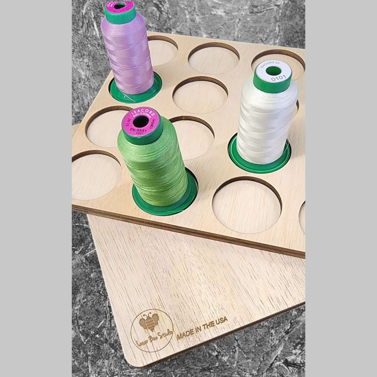 IKEA ALEX 9-Drawer Thread Storage Tray Inserts — close-up of four thread spools in a wooden tray