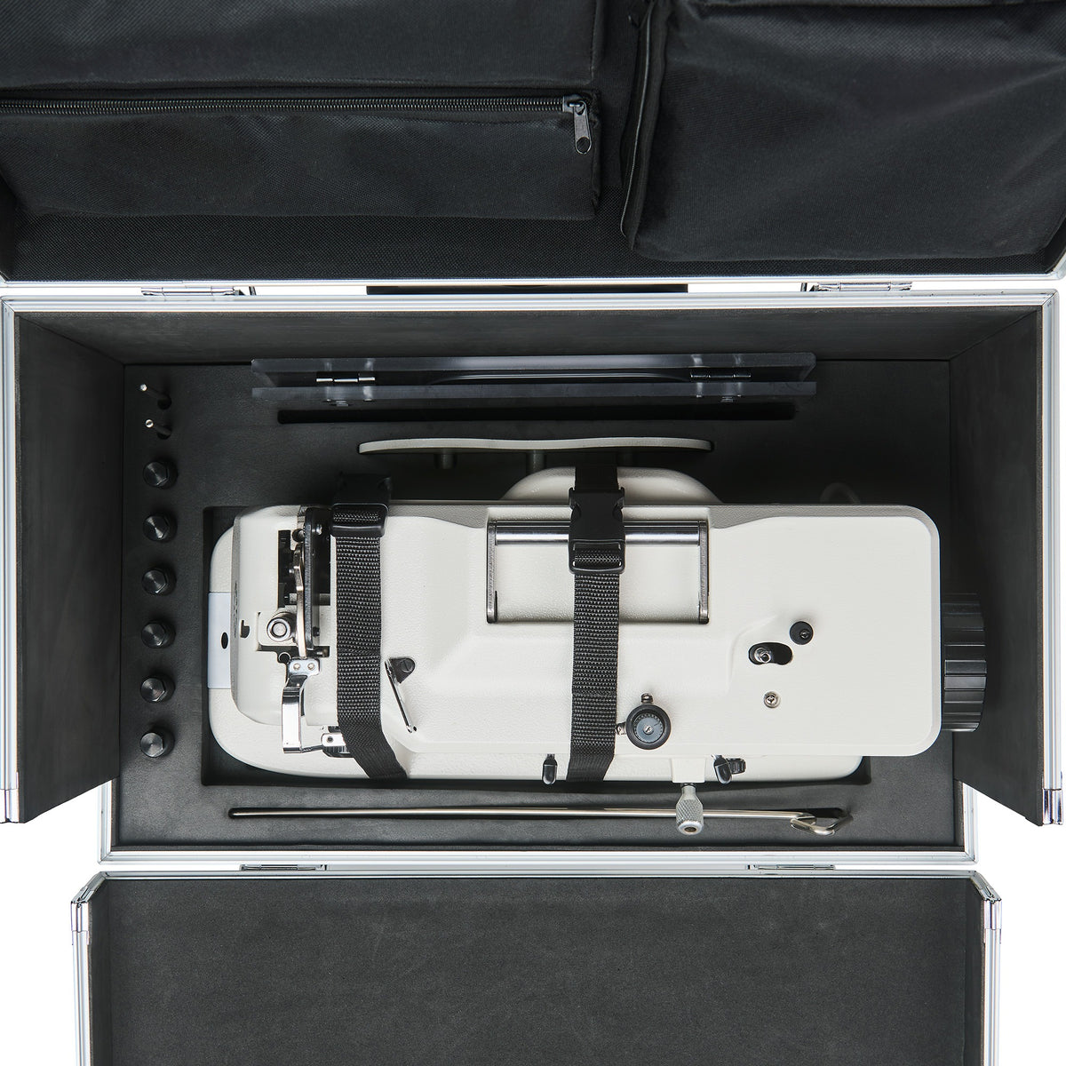 Sewing machine and accessories secured by the CudaCase internal strap