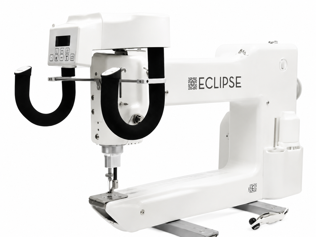 A white industrial sewing machine with a digital control panel and black curved guide arms, branded ECLIPSE, shown on a plain white background.