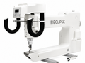 A white industrial sewing machine with a digital control panel and black curved guide arms, branded ECLIPSE, shown on a plain white background.
