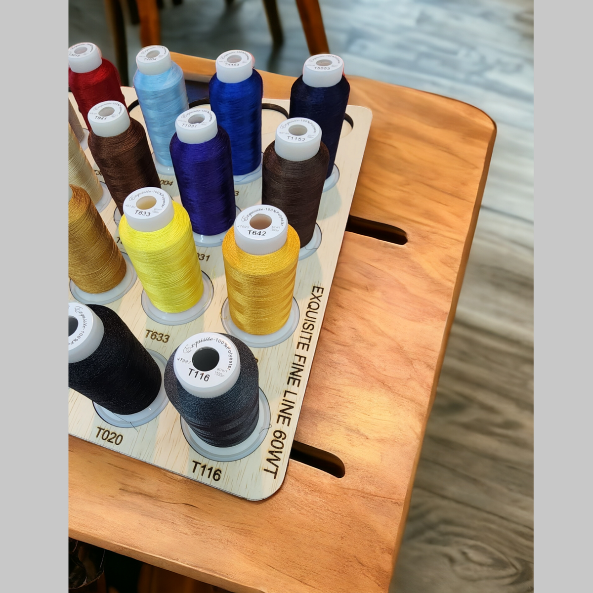 Exquisite Fine Line 60wt Thread Storage Tray, 30 Spools — angled view of colored spools in the tray