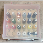 Exquisite Fine Line 60wt Thread Storage Tray, 30 Spools — filled tray beneath a closed clear case lid