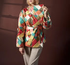 Person wearing a colorful checkered jacket against a dark background