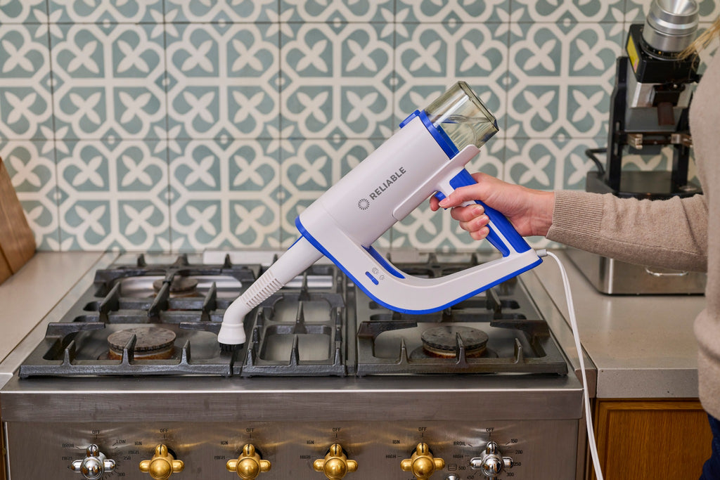 Steamboy Plus 350CS cleaning a gas cooktop with concentrated steam