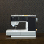 Sewing machine with 'PFAFF' branding on a dark background