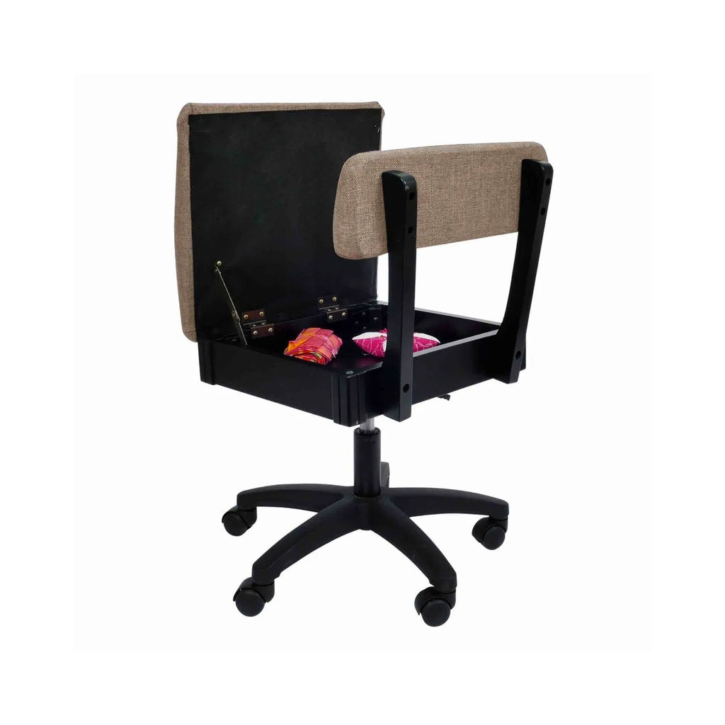 Arrow Princess Hazel Hydraulic Sewing Chair – open storage seat compartment with sewing notions inside, featuring durable tan textured upholstery.