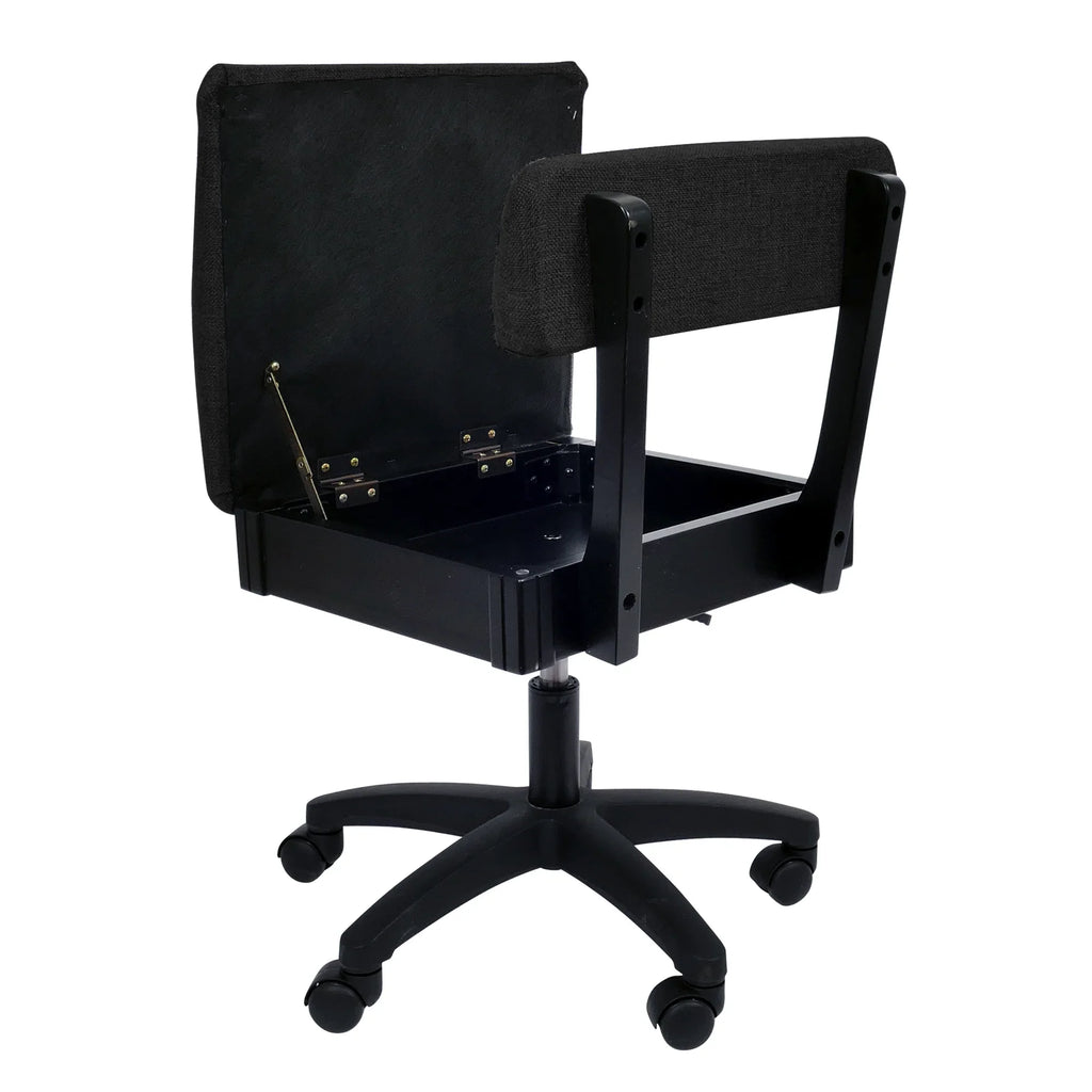 Arrow Baroness Black Hydraulic Sewing Chair – open storage seat compartment with empty interior, featuring durable black fabric upholstery.