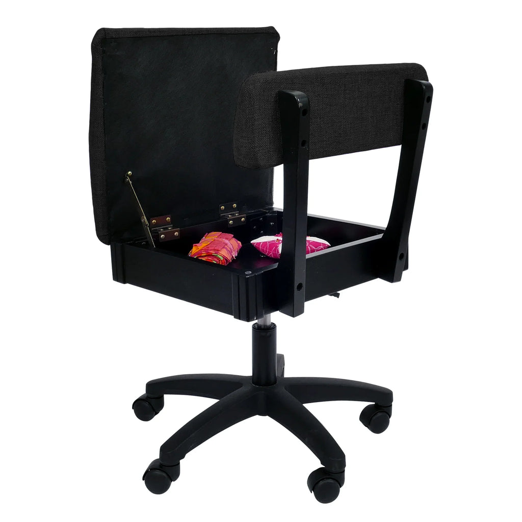 Arrow Baroness Black Hydraulic Sewing Chair – open seat storage compartment with sewing notions inside, paired with black textured upholstery.