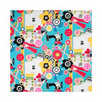 Arrow Sew Wow Sewing Chair fabric close-up – bright blue upholstery with colorful buttons, flowers, measuring tape, sewing machines, and craft motifs.