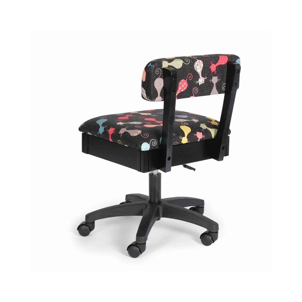 Arrow Cat’s Meow Hydraulic Sewing Chair Black – rear angle view highlighting padded cat-print fabric, sturdy frame, and smooth-rolling casters.