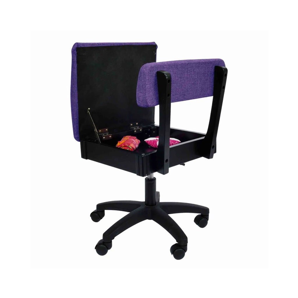 Arrow Royal Purple Hydraulic Sewing Chair – open storage seat compartment with sewing notions inside, featuring durable woven purple upholstery.