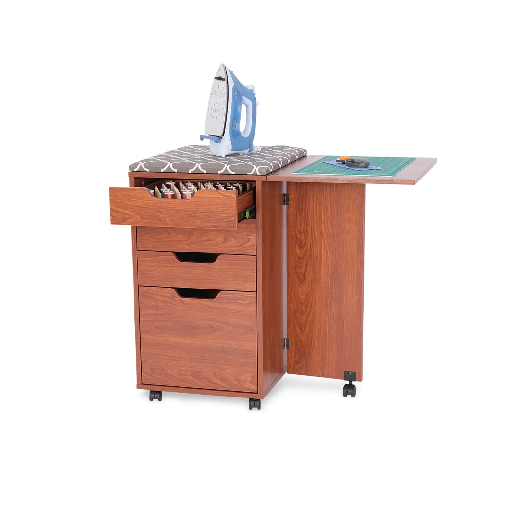 Kangaroo Kiwi Storage Cabinet in Teak K7105 used as an ironing and cutting station