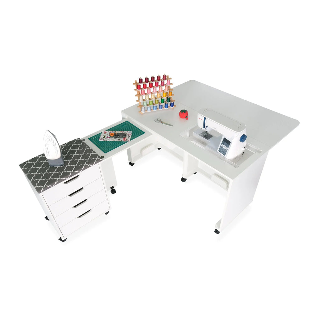 Arrow Laverne & Shirley Sewing Cabinet setup with ironing station, cutting mat, and sewing machine for quilting projects.