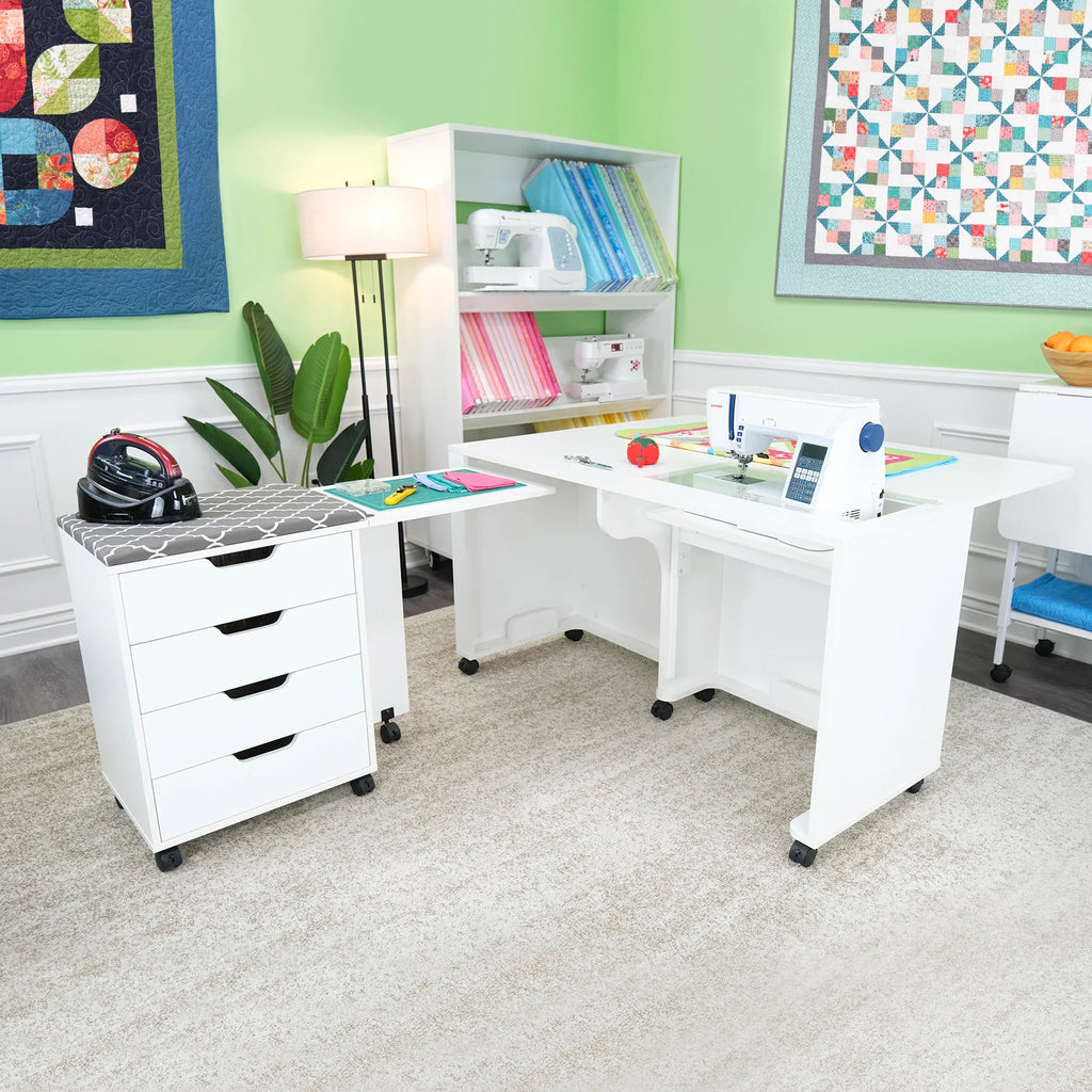 Arrow Laverne & Shirley Sewing Cabinet styled in sewing room with ironing station, fabrics, and sewing tools.
