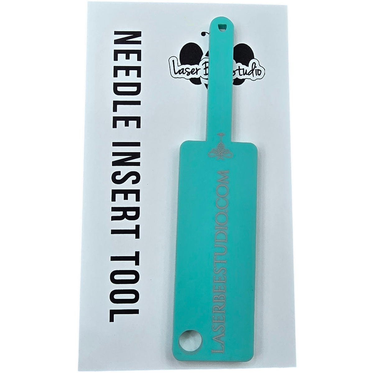 Acrylic needle insertion tool on its Laser Bee Studio backing card