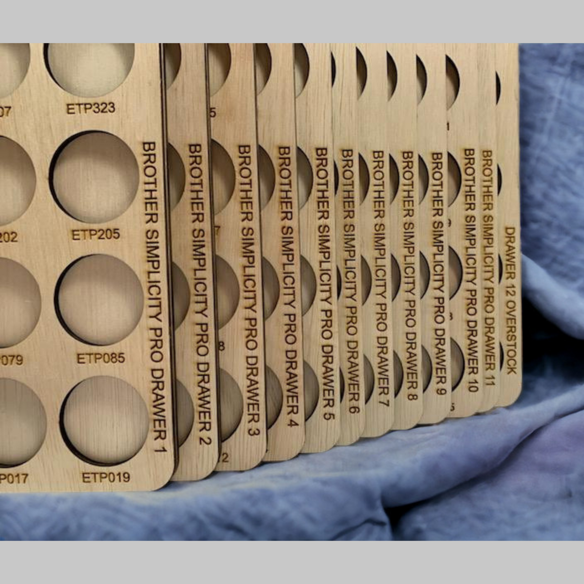 Brother Simplicity Pro Thread Storage Trays, 360 Spools — close-up of engraved drawer labels on stacked trays