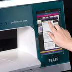 PFAFF sewing machine with a hand interacting with the touchscreen interface