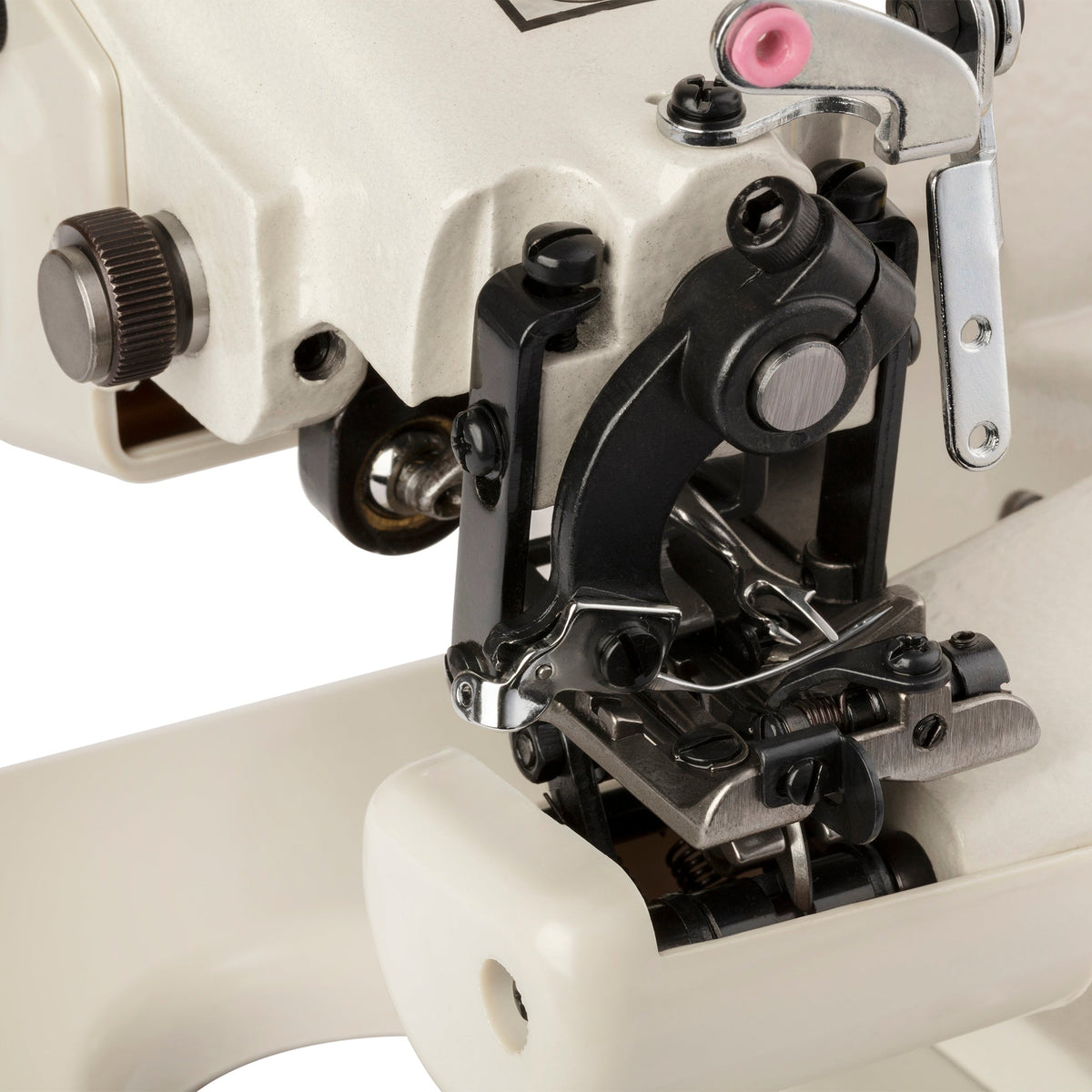 Close-up of the Consew 75T needle, presser foot, and blindstitch mechanism.