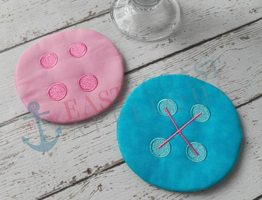 Finished pink and turquoise in-the-hoop button coasters