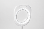 Close-up of the illuminated 5-inch magnifying lens on the white Daylight UN1080 lamp