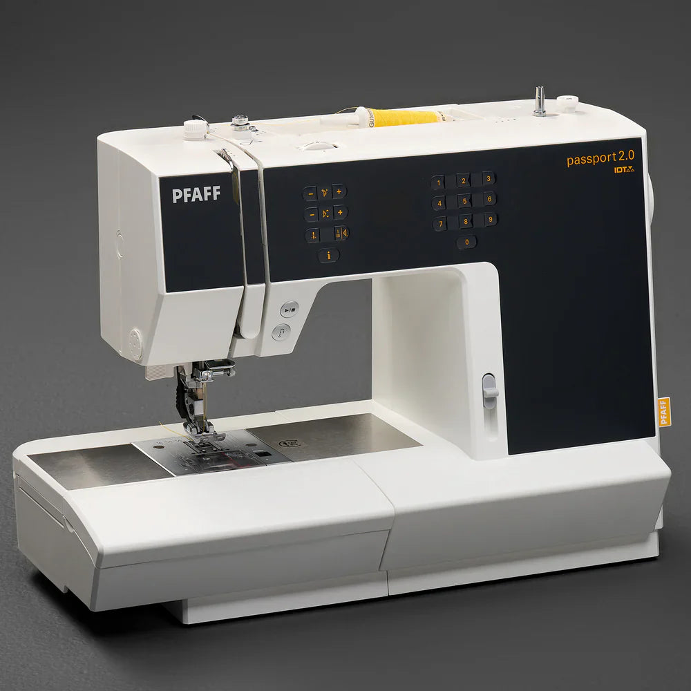 PFAFF sewing machine on a dark background