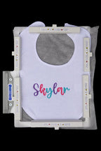 Baby bib secured in a Durkee 5x7 Magnetic EZ Frame