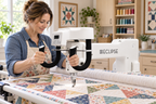 Eclipse EQ20 long arm quilting machine quilting a patchwork quilt in a home studio