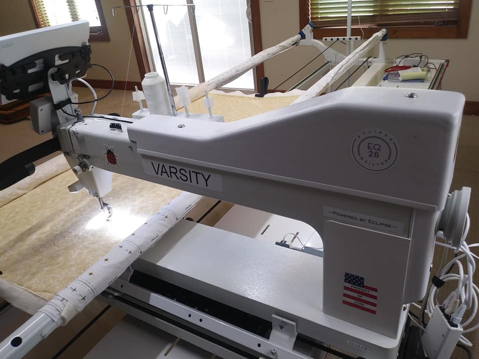 Eclipse VARSITY 26 long arm quilting machine installed on its frame in a home quilting room