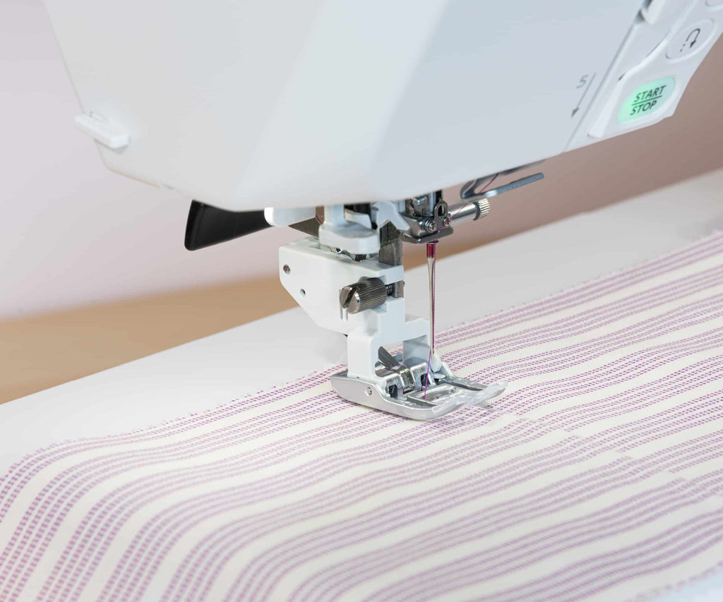 Elna eXcellence 710 presser foot stitching fabric