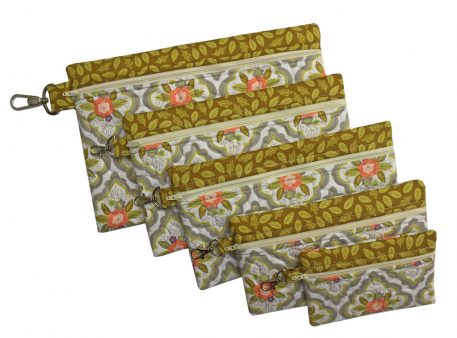 Set of six green and floral in-the-hoop zippered bags in graduated rectangular sizes