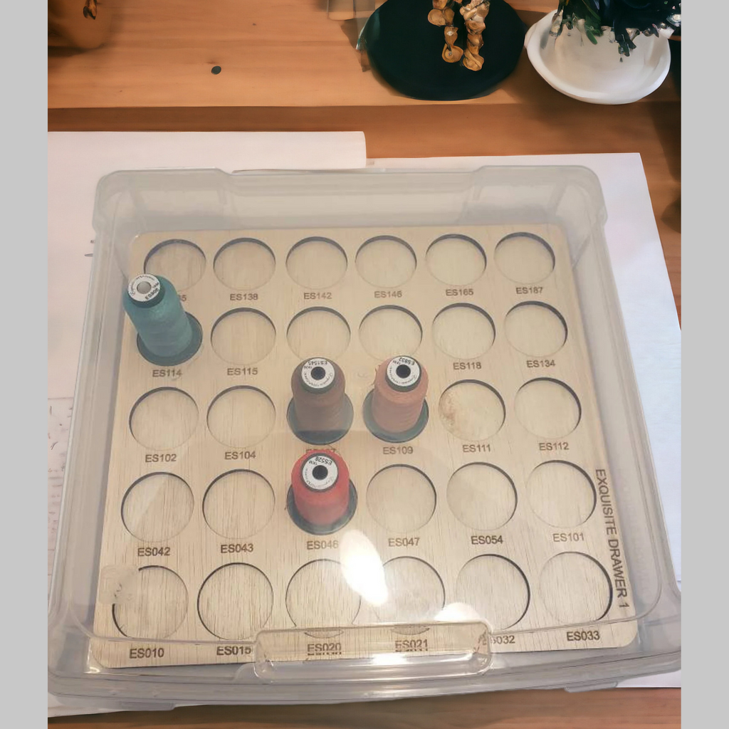 Exquisite Embroidery Thread Storage Trays, 360 Spools — tray and spools beneath a closed clear lid