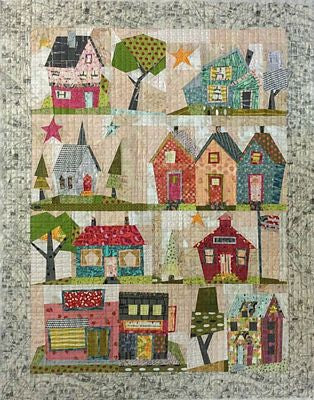 My Kinda Town Paper Pieced Quilt Pattern by Peggy Larsen — pattern cover and finished project