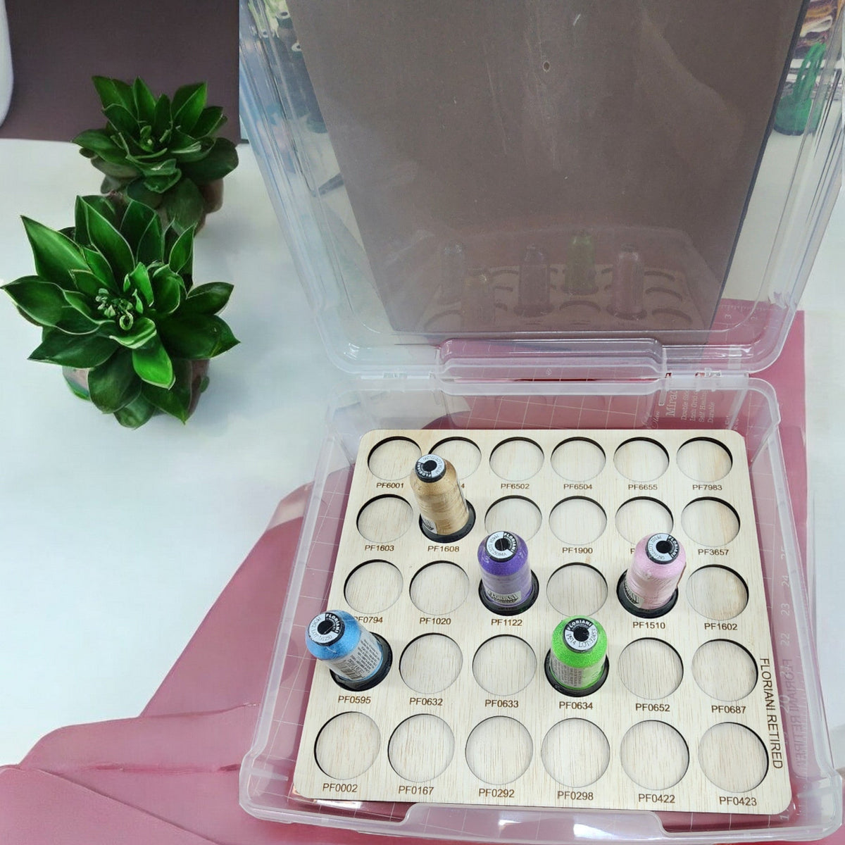 Floriani Retired Colors Thread Storage Tray, 30 Spools — tray and spools inside an open clear case