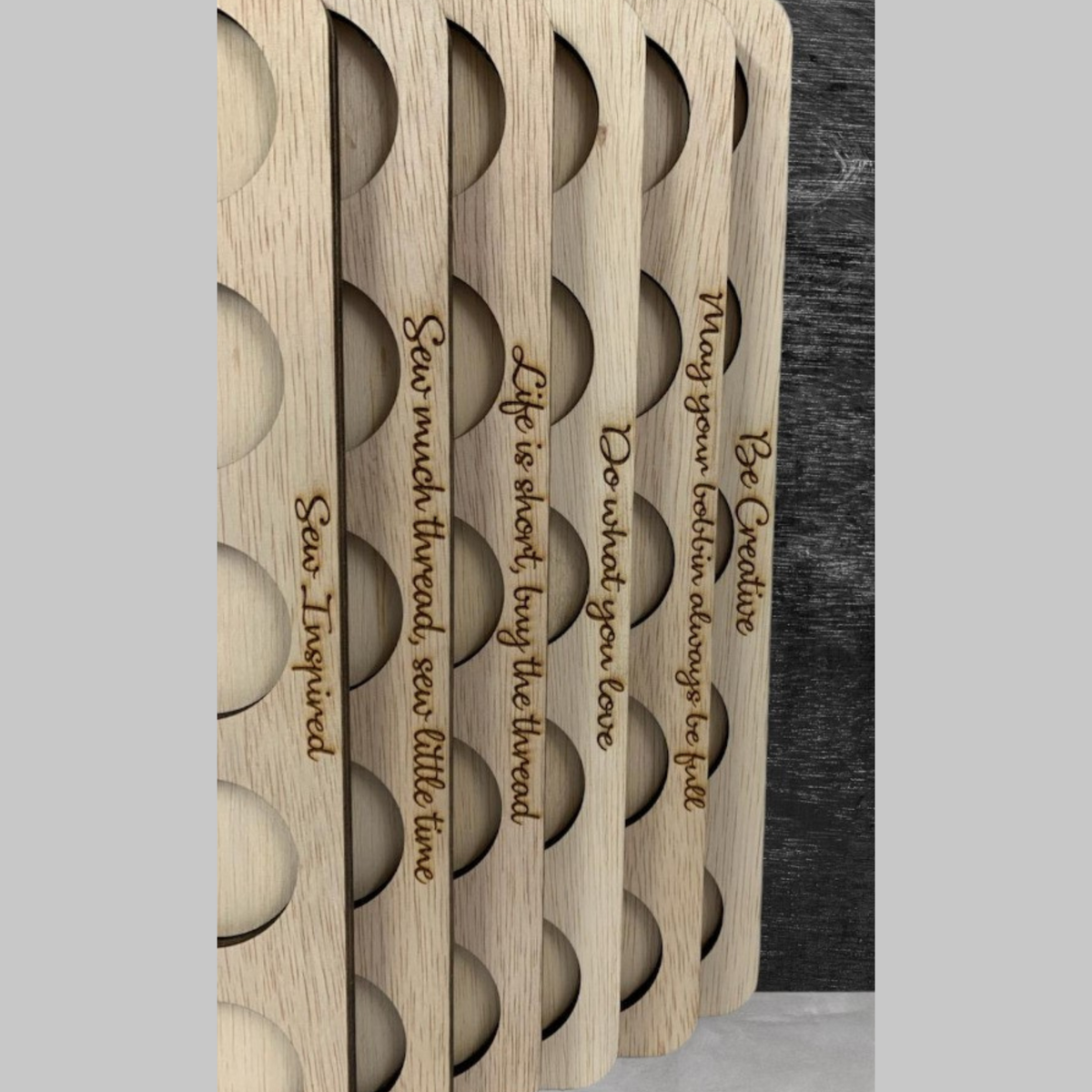 Embroidery Thread Storage Trays, Set of 6 — angled view of stacked trays and engraved quotes