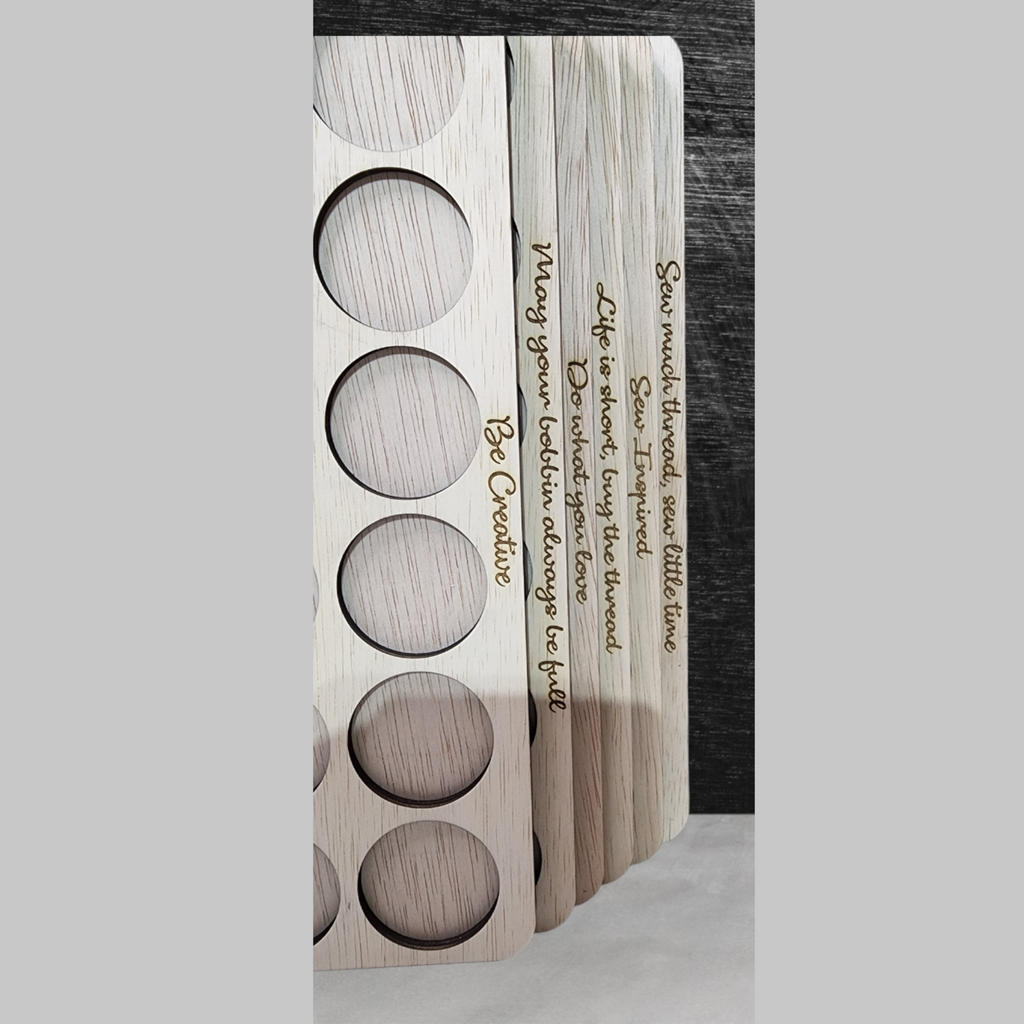 Embroidery Thread Storage Trays, Set of 6 — close-up of the engraved sewing quote on a tray edge