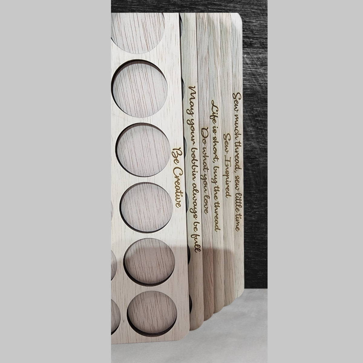 Embroidery Thread Storage Trays, Set of 6 — close-up of the engraved sewing quote on a tray edge