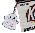 White ghost bag charm with pink cheeks and orange BOO embroidery clipped to a zippered bag