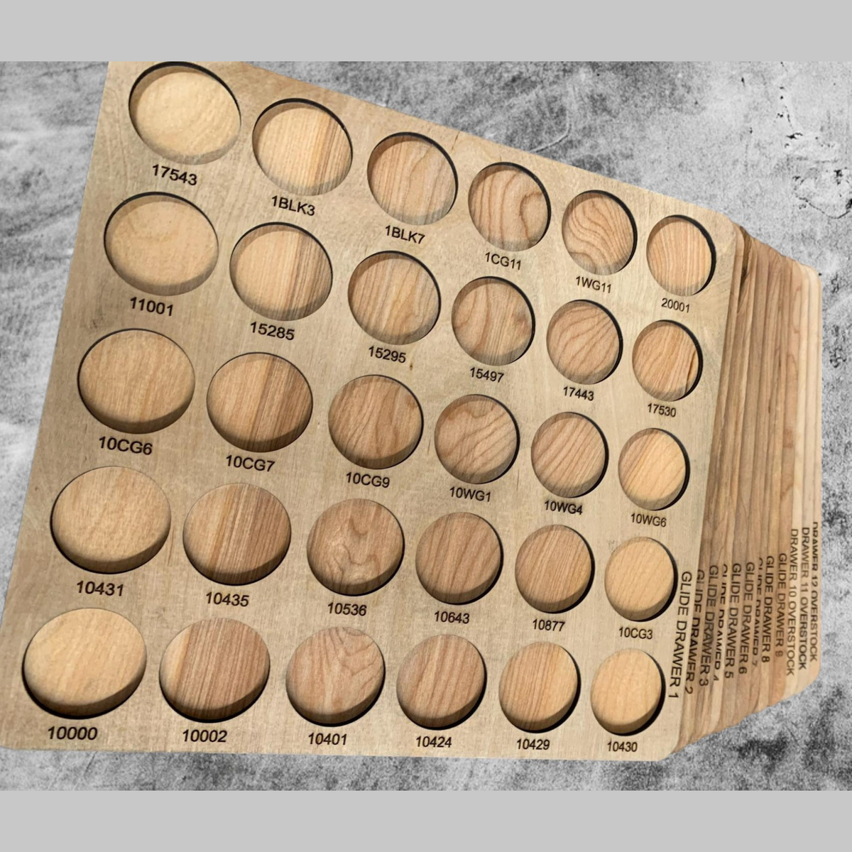 Glide Numbered Thread Storage Trays, 450 Spools — angled view of an empty numbered tray and stacked trays