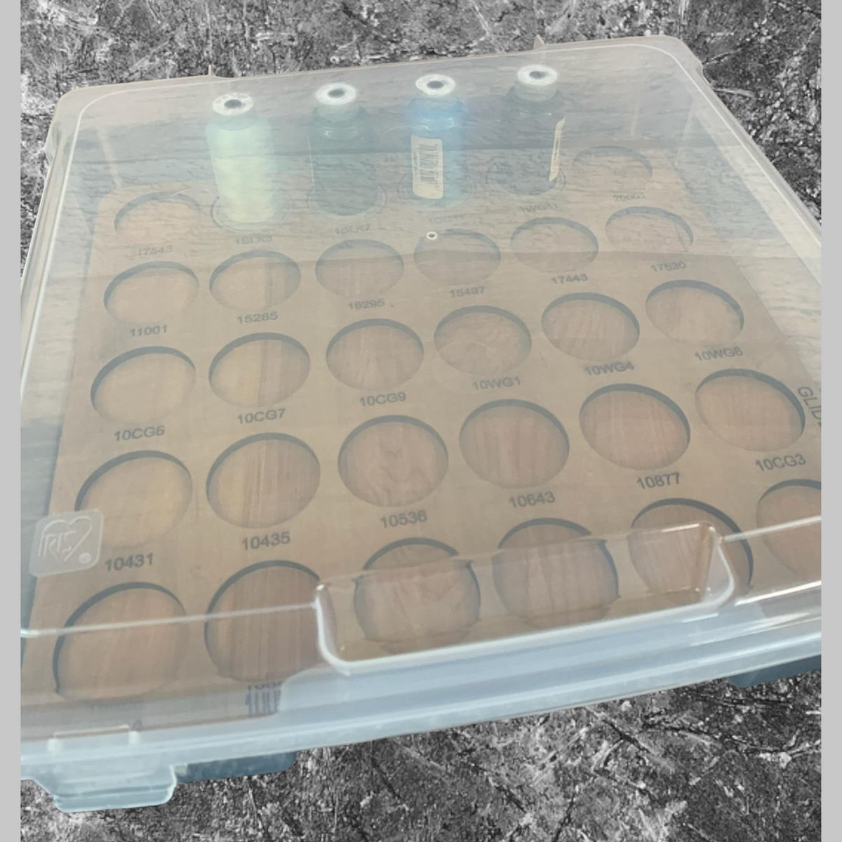 Glide Numbered Thread Storage Trays, 450 Spools — tray and spools beneath a closed clear lid