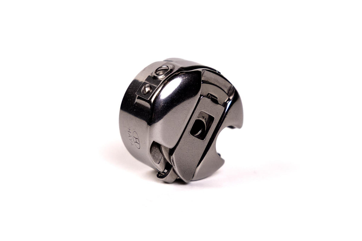 Grace M-Class bobbin case latch and side detail
